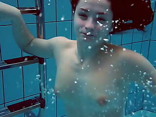 Chubby tits teenie Liza Bubarek swimming naked in the pool