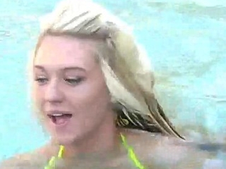 Busty teen in the pool