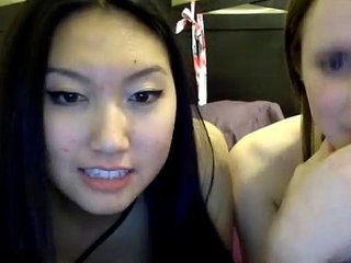 Asian plus white lesbians have fun during camshow